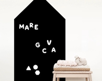 May include: Black chalkboard wall decal shaped like a house with white letters spelling "MARE" and "GVCA" and white geometric shapes.