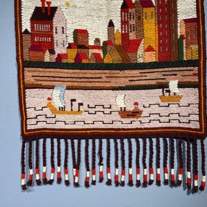 Modern Wall hanging wool weaving tapestry braided fringes, boat house.