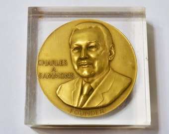 Vintage RLI Charles A Sammons Paperweight Bronze Medallion Encased in Lucite Advertising PanchosPorch