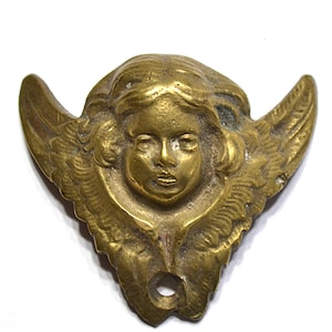 May include: A white ceramic mug with a black handle and the text "But First, Coffee" in a black, bold font. The mug is on a white surface.