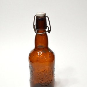 Vintage Grolsch Beer Bottle: Dark Amber Embossed Glass with Swing Top