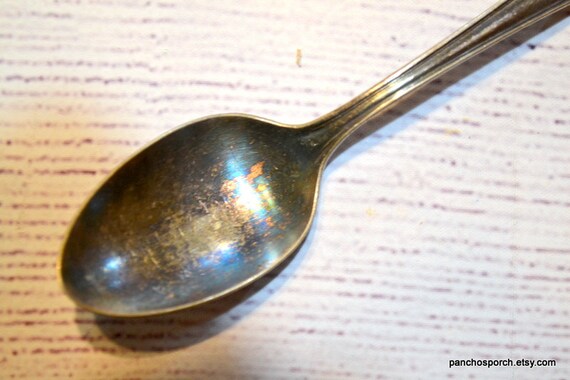 Old company shop plate spoon