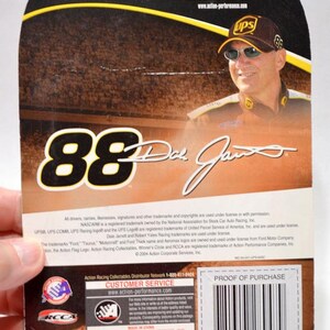 May include: Back of a collectible card featuring Dale Jarrett, the number 88, and the UPS logo. The card includes the text "Collect All of the Winner's Circle Items!" and "Action Racing Collectables Distributor Network".
