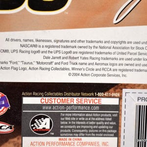 May include: A product information label with text including NASCAR, UPS, and Action Racing Collectables logos. The label also includes a customer service contact and website address.
