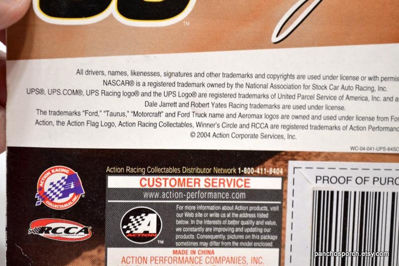 May include: A product information label with text including NASCAR, UPS, and Action Racing Collectables logos. The label also includes a customer service contact and website address.