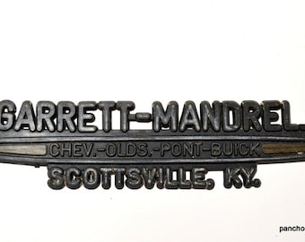 Vintage Garrett Mandrel Dealership Emblem Chevrolet Pontiac Buick Logo Scottsville Kentucky Plastic Advertising Gray Black Auto PanchosPorch