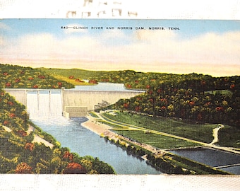 May include: A vintage postcard depicting the Clinch River and Norris Dam in Norris, Tennessee. The postcard shows a scenic view of the dam and the river, with lush green trees and a blue sky in the background.