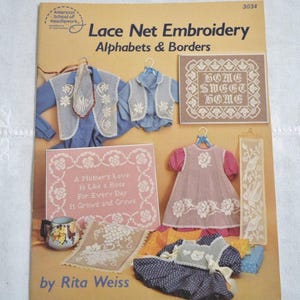 May include: A tan instructional booklet titled Lace Net Embroidery Alphabets & Borders by Rita Weiss. The cover displays various needlework projects including embroidered vests, a Home Sweet Home sampler, a rose-themed sampler, and clothing.