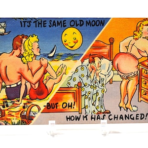May include: Vintage postcard with a humorous illustration. The image is split into two scenes: a couple on a beach and a woman in a bedroom. Text reads "IT'S THE SAME OLD MOON - BUT OH! HOW IT HAS CHANGED!"