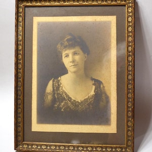 Vintage Sepia Portrait: Woman in Wooden Frame, Nostalgic Wall Decor