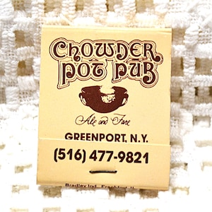 May include: A matchbook with the text "CHOWDER POT PUB" in brown, along with a brown illustration of a bowl. The text "Ale and Fare" and the pub's location and phone number are also visible.