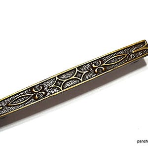 May include: A trio of ceramic mugs with a speckled, matte finish in cream, light brown, and dark brown. The mugs have a simple, minimalist design, ideal for tea or coffee.