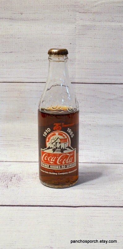 10 OZ COCA COLA COMMEMORATIVE BOTTLE - 1985 INGLES 100TH STORE OPENING