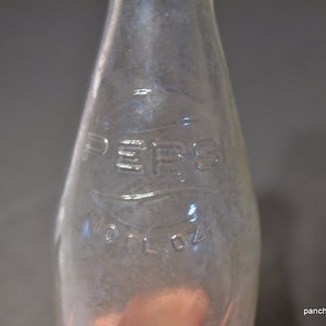 Vintage Pepsi Bottle: 10 oz Clear Glass Swirl Embossed Logo