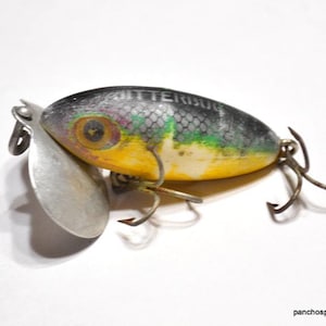 Leurre de pêche vintage Fred Arbogast Jitterbug noir topwater bar 2 Leurre de pêche vintage Fred Arbogast Jitterbug noir topwater bar 2