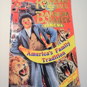 May include: A vintage Ringling Bros. and Barnum & Bailey Circus program cover. The cover features a clown, lions, tigers, and an elephant. Text includes "America's Family Tradition" and "Special Poster Inside."