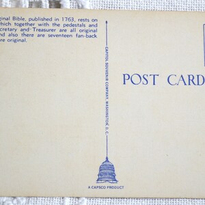 May include: A vintage postcard featuring a blue illustration of the US Capitol building with the text "POST CARD" and "PLACE STAMP HERE" in blue. The back of the postcard has the text "CAPITOL SOUVENIR COMPANY, WASHINGTON, D.C." and "A CAPSCO PRODUCT".