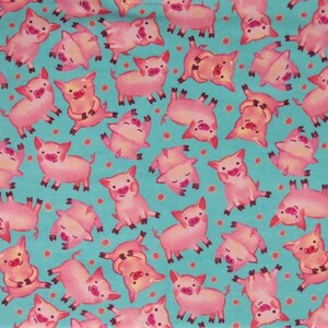 May include: A fabric pattern featuring numerous pink pigs in various poses against a teal background dotted with small orange circles. The pigs have smiling faces and are in different positions.