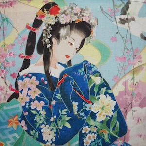 May include: A fabric print featuring a person with dark hair styled in a high ponytail with floral accessories, wearing a deep blue kimono adorned with white and pink floral patterns, set against a light blue background with cherry blossoms.