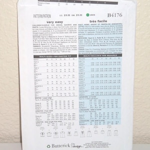 May include: A white Butterick sewing pattern envelope B4176 for children's clothing. The back of the envelope displays technical information, sizing charts in centimetres, fabric requirements, and line drawings of a top, dress, shorts, and trousers.