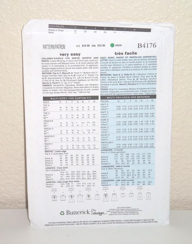 May include: A white Butterick sewing pattern envelope B4176 for children's clothing. The back of the envelope displays technical information, sizing charts in centimetres, fabric requirements, and line drawings of a top, dress, shorts, and trousers.