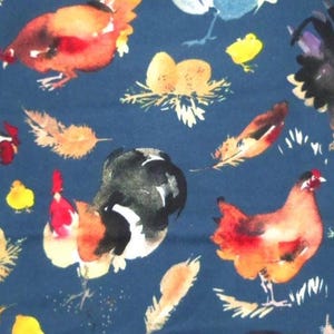 May include: A navy blue fabric featuring a watercolor design of chickens, roosters, feathers, and nests with eggs. The chickens are in shades of red, orange, black, and white. Yellow chicks and feathers are scattered across the fabric.