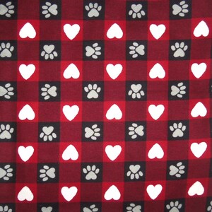 May include: Red and black checkered fabric with white hearts and gray paw prints.