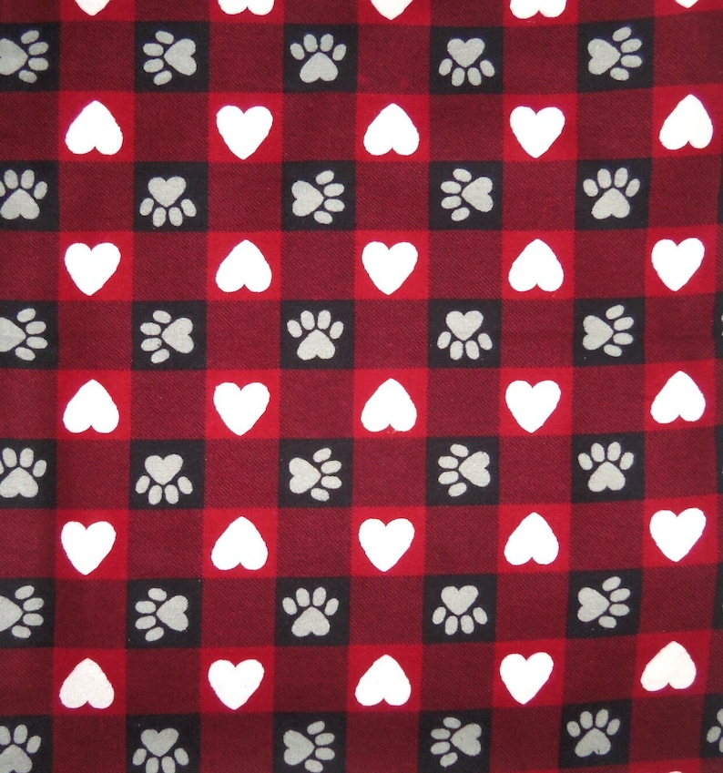May include: Red and black checkered fabric with white hearts and gray paw prints.