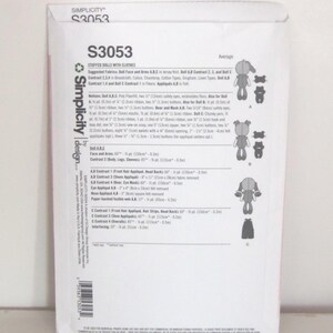 May include: A Simplicity S3053 pattern for stuffed dolls with clothes. The pattern includes instructions for making dolls with various outfits. The package features illustrations of the finished dolls and their clothing, along with fabric and notion suggestions.