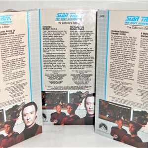 May include: Three Star Trek The Next Generation Collector's Edition VHS tape sleeves featuring episode summaries for Conspiracy, The Neutral Zone, Unnatural Selection, and A Matter of Honor. Each sleeve displays blue logos and cast photographs.
