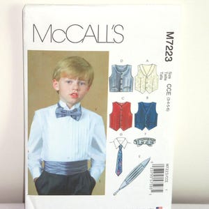 May include: A McCall's sewing pattern for a boy's vest and bow tie. The pattern is for sizes 3-4-5-6. The pattern includes instructions for making a vest, bow tie, and cummerbund. The pattern is designed and printed in the USA.