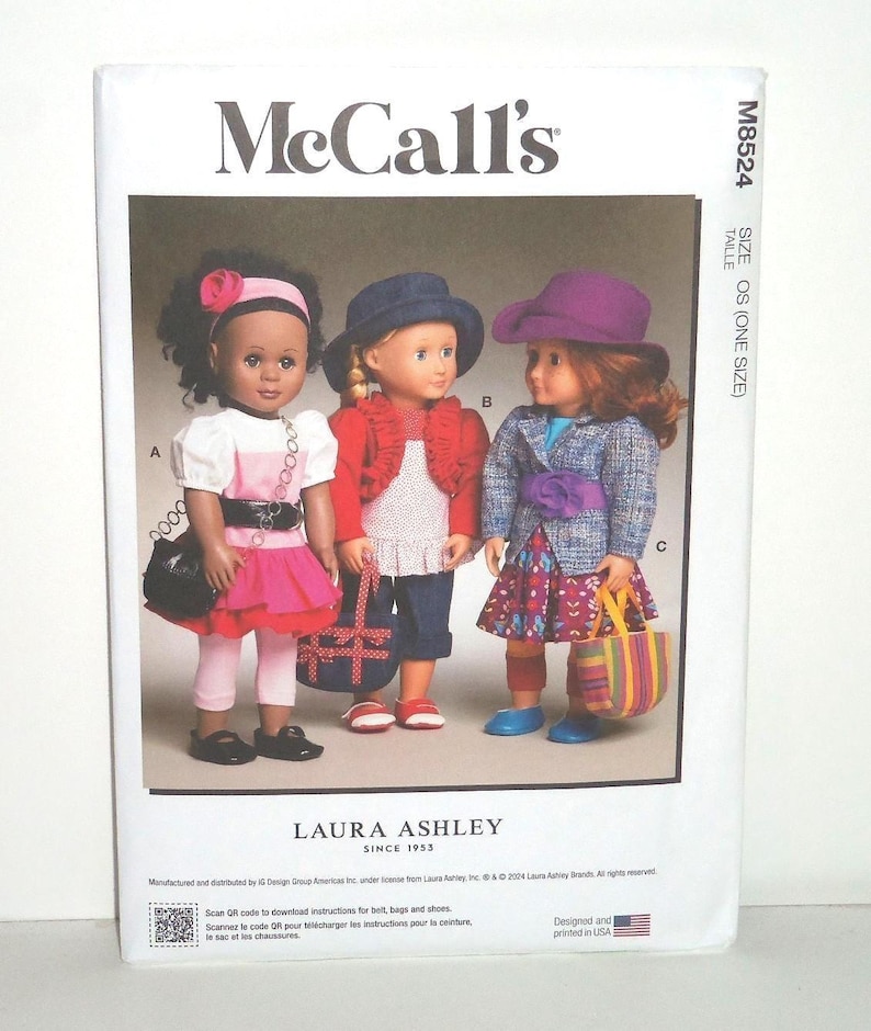 May include: McCall's sewing pattern featuring three dolls in Laura Ashley outfits. The dolls wear dresses, jackets, and hats, with accessories like purses and a belt. The pattern includes instructions for belts, bags, and shoes.