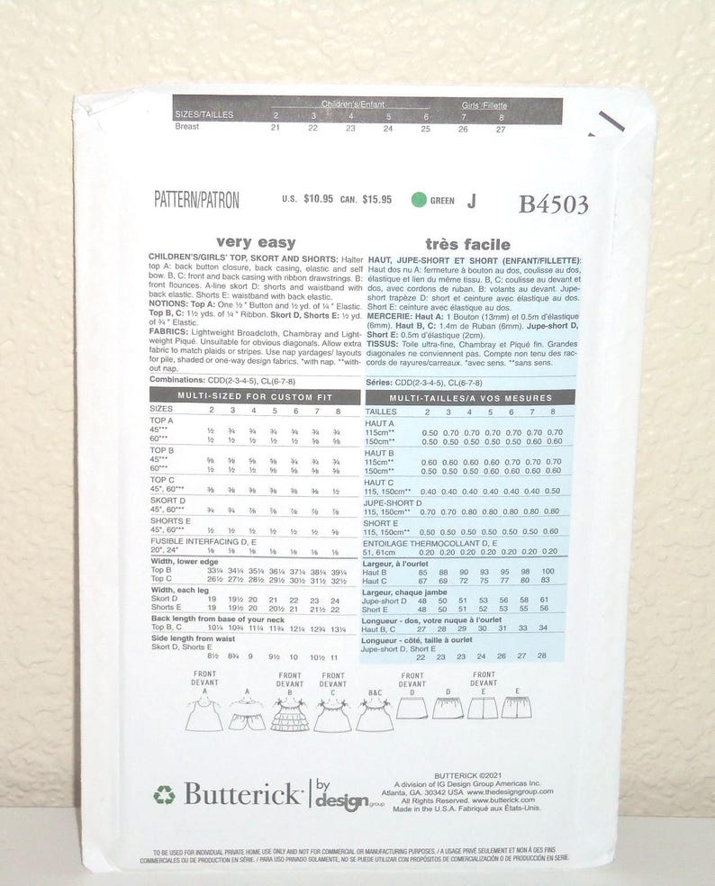 May include: A white Butterick sewing pattern envelope B4503 for children's and girls' tops, skorts, and shorts. The back of the envelope displays technical illustrations, sizing charts in inches, fabric requirements, and instructions in English and French.