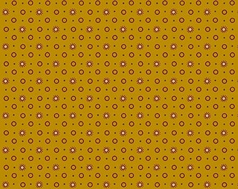 May include: A seamless pattern featuring a repeating design of small circles and stylized suns in shades of brown and pink on a mustard yellow background.