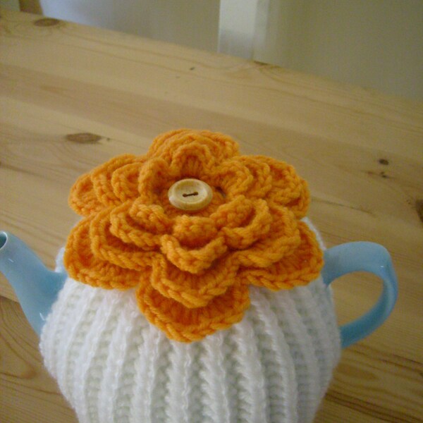 Knitted Tea Cosy withTangerine Flower Topper