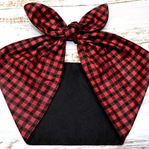 May include: A red and black checkered headband with a bow. The headband is made of a soft, silky fabric.
