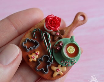 Miniature composition with Christmas gingerbread and a cup of tea. Handmade, polymer clay. Dollhouse. Miniature food. Doll kitchen.