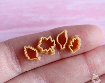 Miniature cutters for doll kitchen on a scale of 1 to 12, cutters leaves (4 pieces) in gold color. PLA plastic.