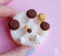 Silicone mold for polymer clay. Miniature cupcakes in different sizes. The mold can be baked. Random colors product logo