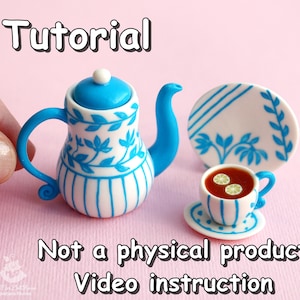 May include: A blue and white teapot with a floral design and a matching teacup and saucer. The teacup is filled with red tea and lemon slices. The image includes the text "Tutorial" and "Not a physical product Video instruction".