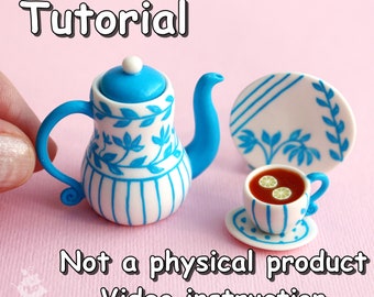 May include: A blue and white teapot with a floral design and a matching teacup and saucer. The teacup is filled with red tea and lemon slices. The image includes the text "Tutorial" and "Not a physical product Video instruction".