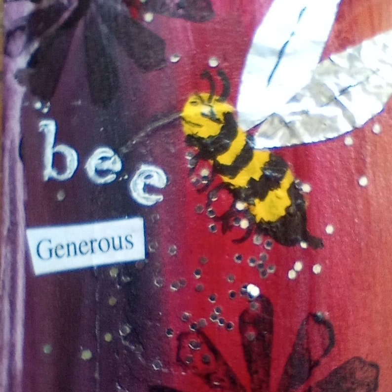 May include: A colorful artwork featuring a bee with yellow and black stripes and silver wings. The word "bee" is written in white, and the word "Generous" is on a small white rectangle. The background is a mix of red, purple, and black.