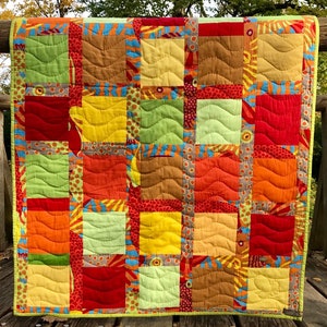 Patchwork Decke Quilt bunte Quadrate Bild 1