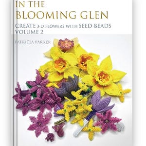 May include: Book cover featuring a close-up of a bouquet of yellow and purple beaded flowers. The title of the book is "In the Blooming Glen: Create 3-D Flowers with Seed Beads, Volume 2" by Patricia Parker.