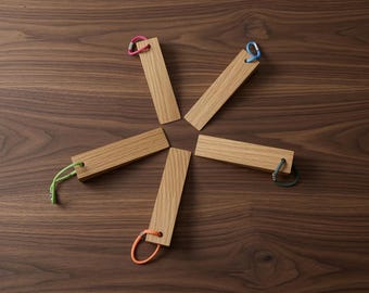 Handcrafted door wedge made of solid oak, minimalist doorstop with colored cord