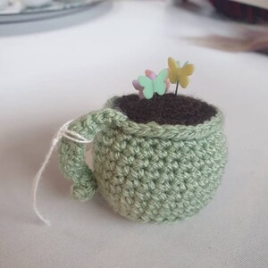 Tea cup pin cushion with pins image 4