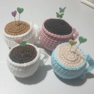 Tea cup pin cushion with pins image 1