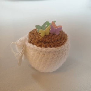 Tea cup pin cushion with pins image 3