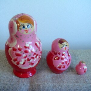 Vintage wood Matroshka Dolls 3 pcs in pink red and white colors Handpainted dolls handcarved wooden dolls Swedish handmade Souvenirs
