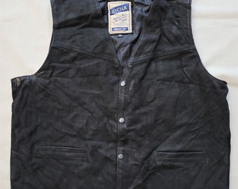 May include: Black leather vest with a snap closure and two pockets. The vest has a label that reads "Richa World's Best Motorcycle Gear" and "Vintage Look".